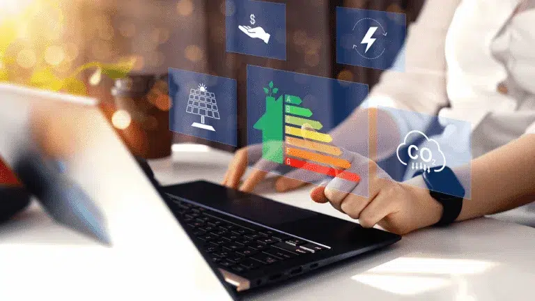 A person analyzes energy efficiency and sustainability data on a laptop interface — Enhancing Construction Efficiency Key Factors and Strategies article